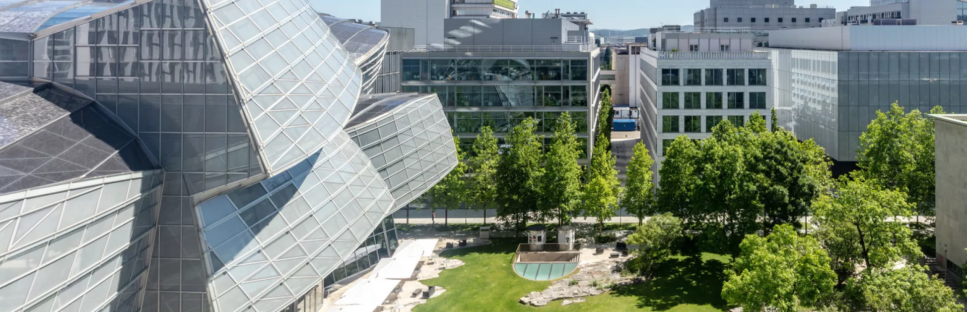 The view from the top floors of Building 210, with the glass 'cloud' building to the left and greenery below