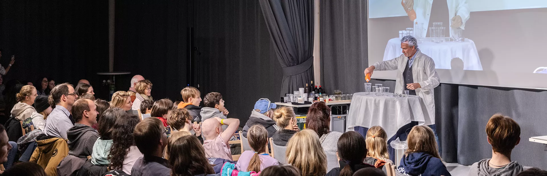 chemist showing crowd magic tricks