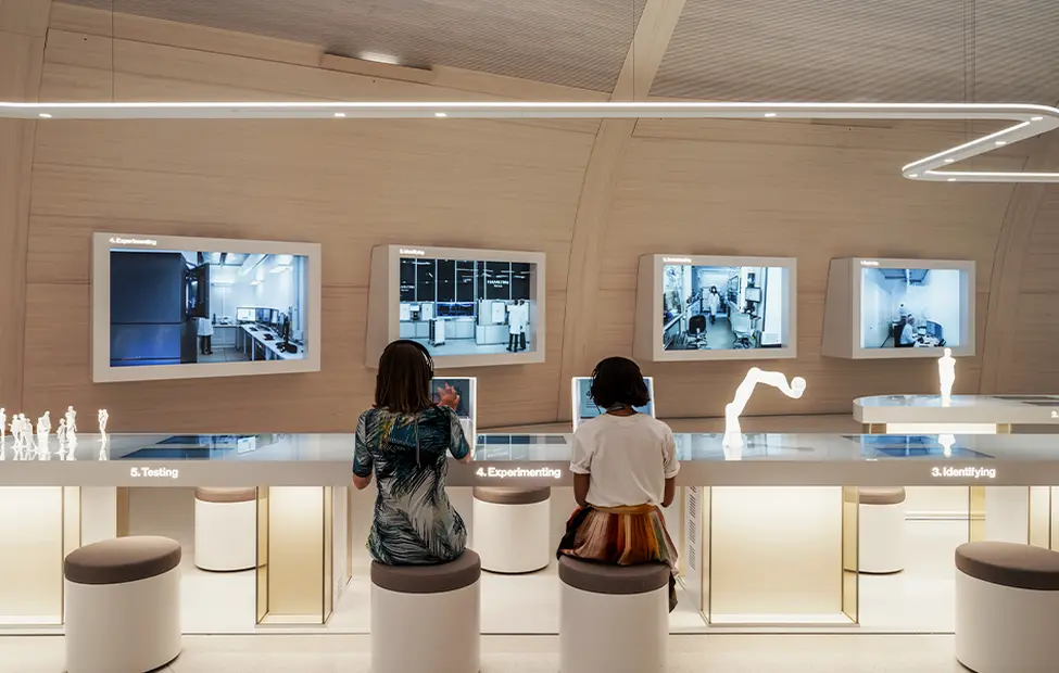 people-observing-interactive-exhibits-in-the-novartis-pavillon