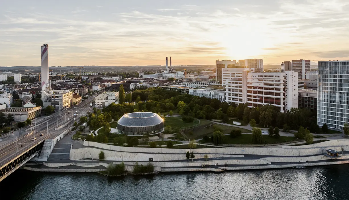 basel-city-with-river-and-the-novartis-campus-at-sunset-header