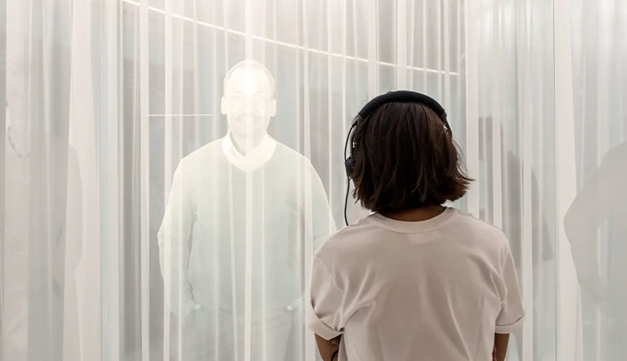 person-observing-figures-in-a-luminous-installation-at-novartis-pavillon